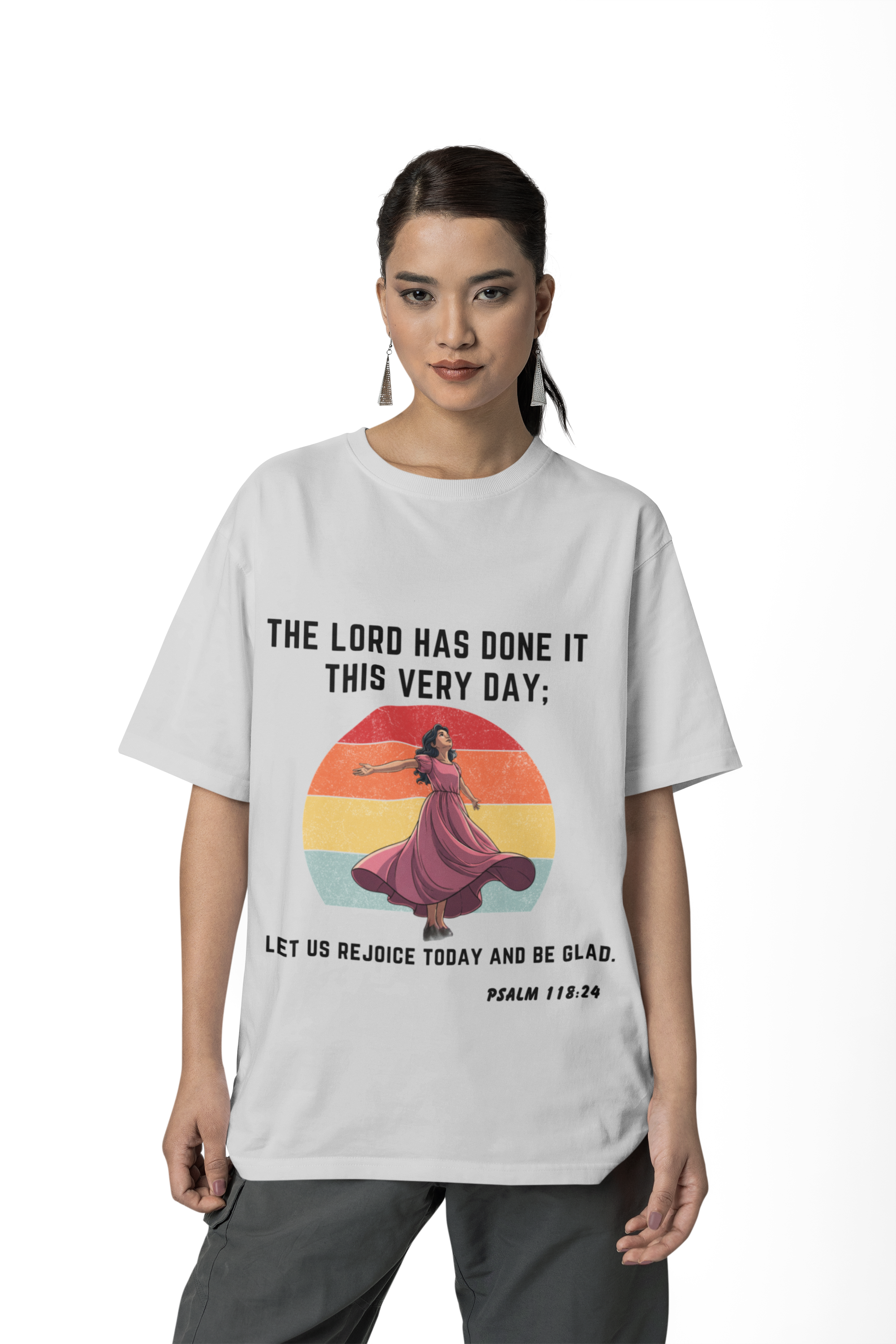 Person wearing a white t-shirt with a colorful graphic and text.