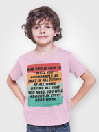 Child wearing a pink t-shirt with motivational quote on a plain background